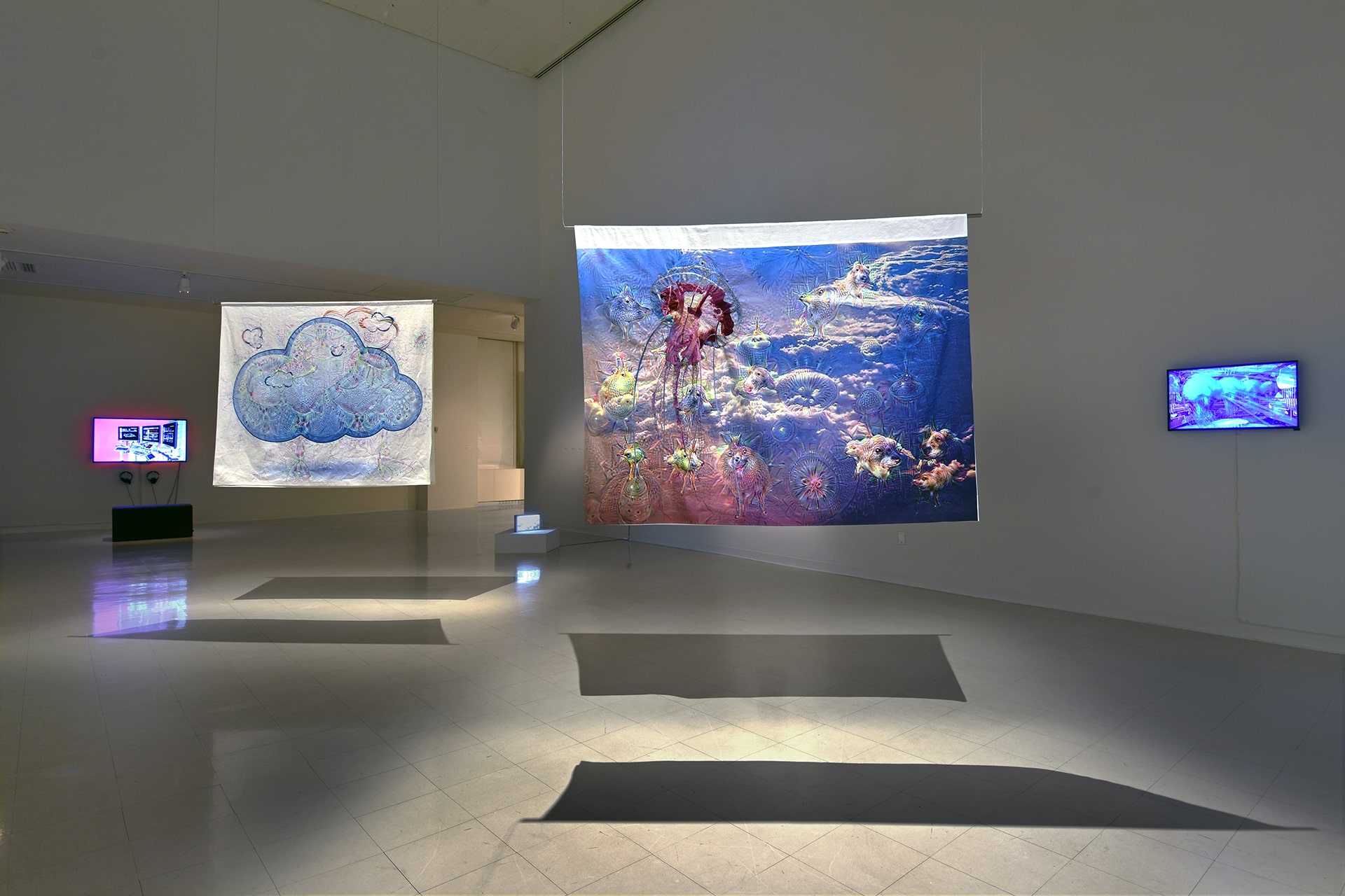 Untitled 1 and 2; two large textile banners with hand embroideries hanging in gallery space