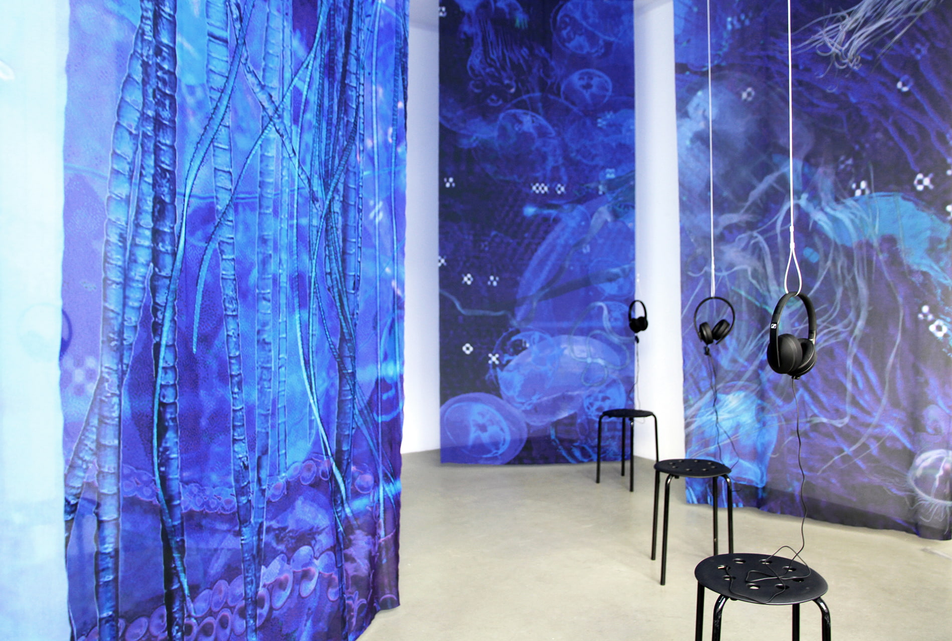 Installation view of Einen Riesigen Schwarm at Digital Art Space Munich - large-format textile banners and sound installation